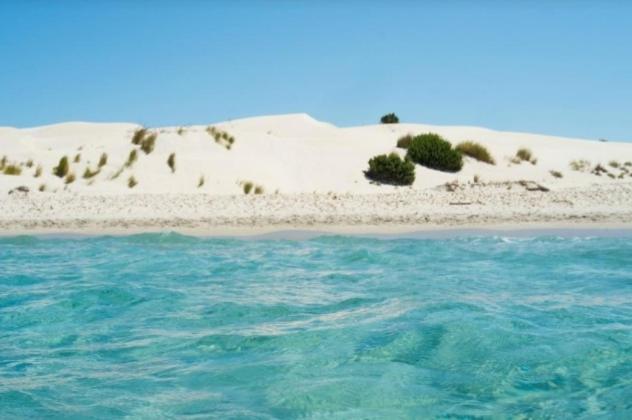 Villa panoramica immersa nel verde Porto Pino Esterno foto